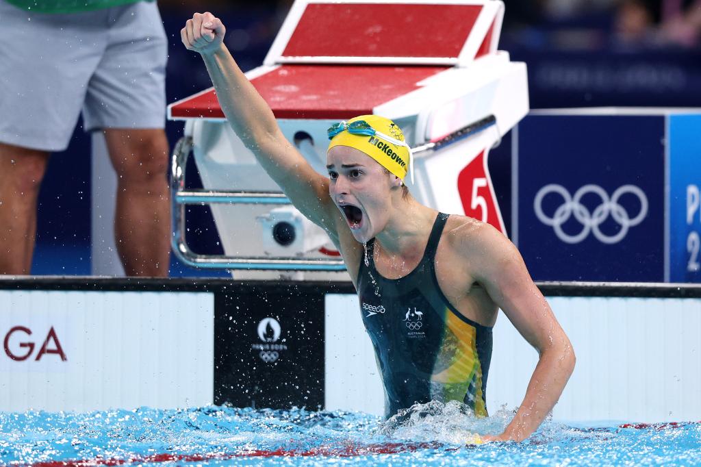 Kaylee McKeown in the pool with her fist in the air after winning a Gold Medal at the Olympic Games Paris 2024